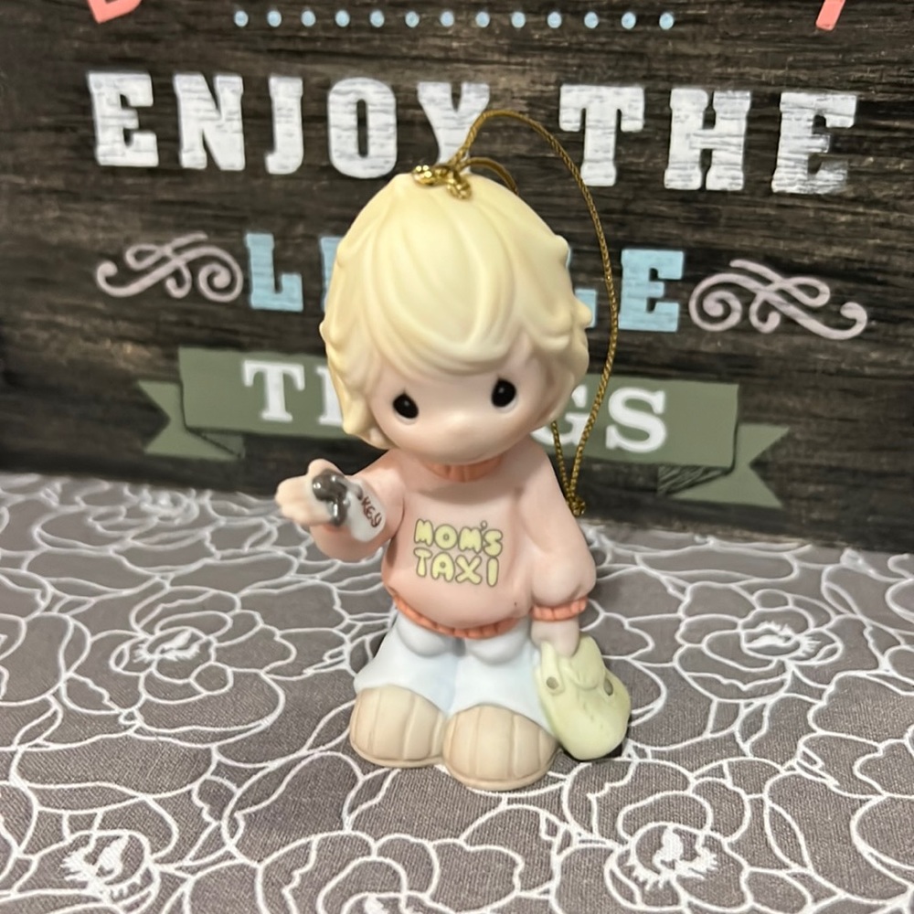 Precious Moments figurine. “Mom’s Taxi”.